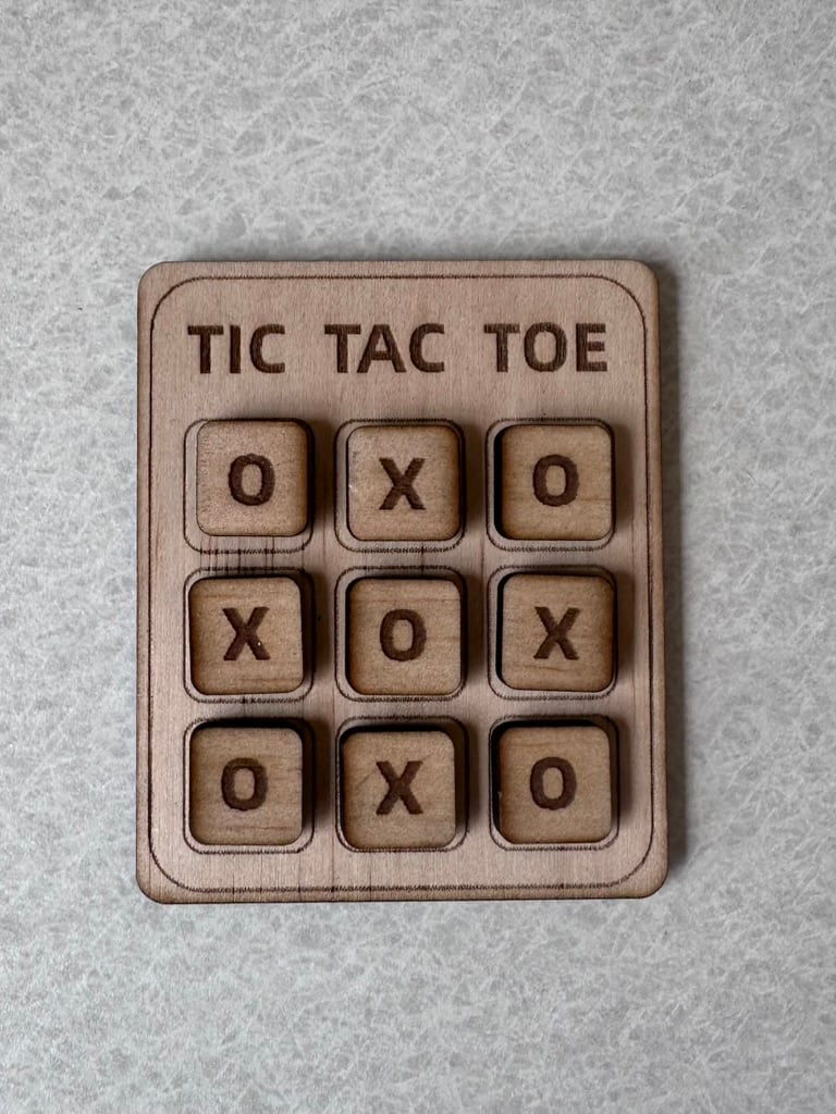 Pocket-sized wooden tic-tac-toe game