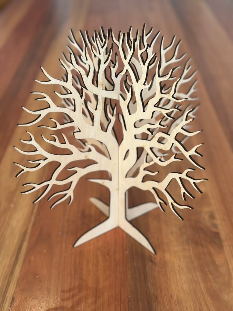 A three-dimensional laser-cut wooden worry tree